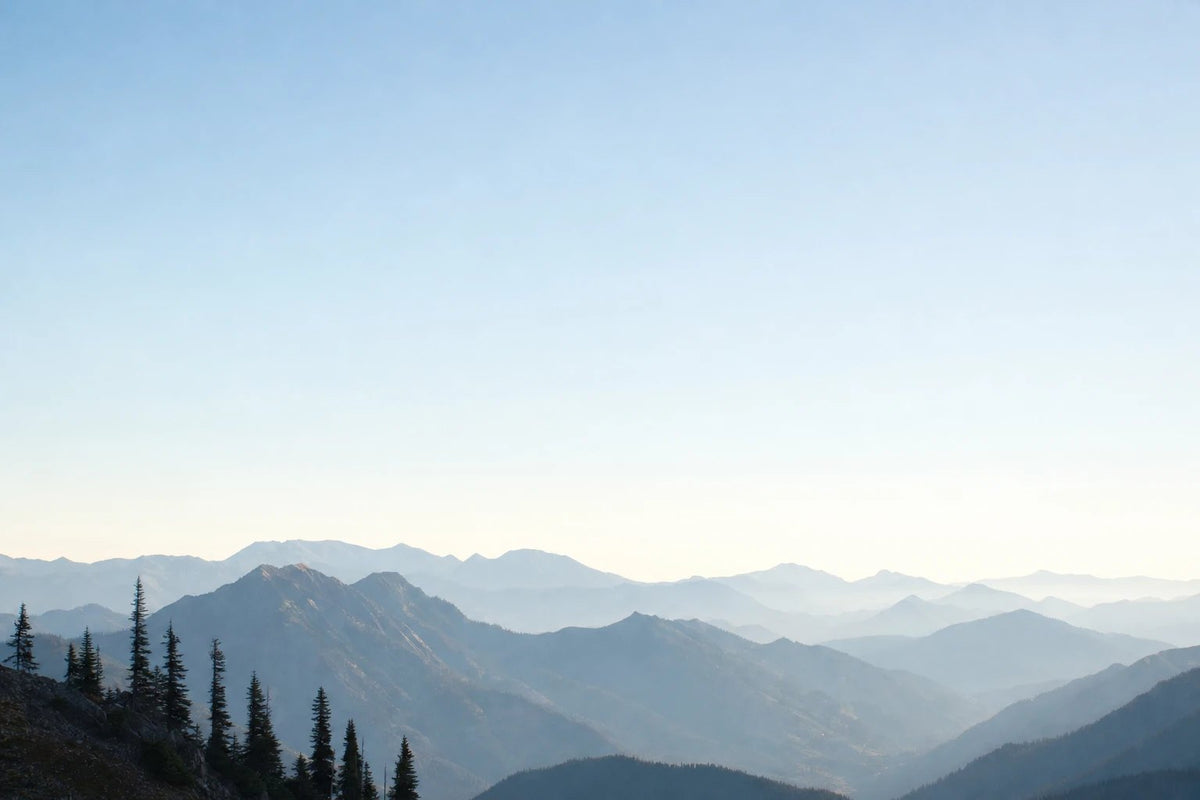 Misty mountain ridges at dawn